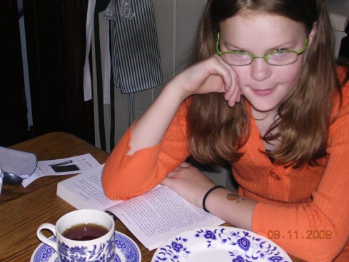 Rose age 10, spending morning tea time finishing homework